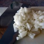 Chopping garlic.