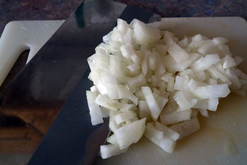 Chopping garlic.